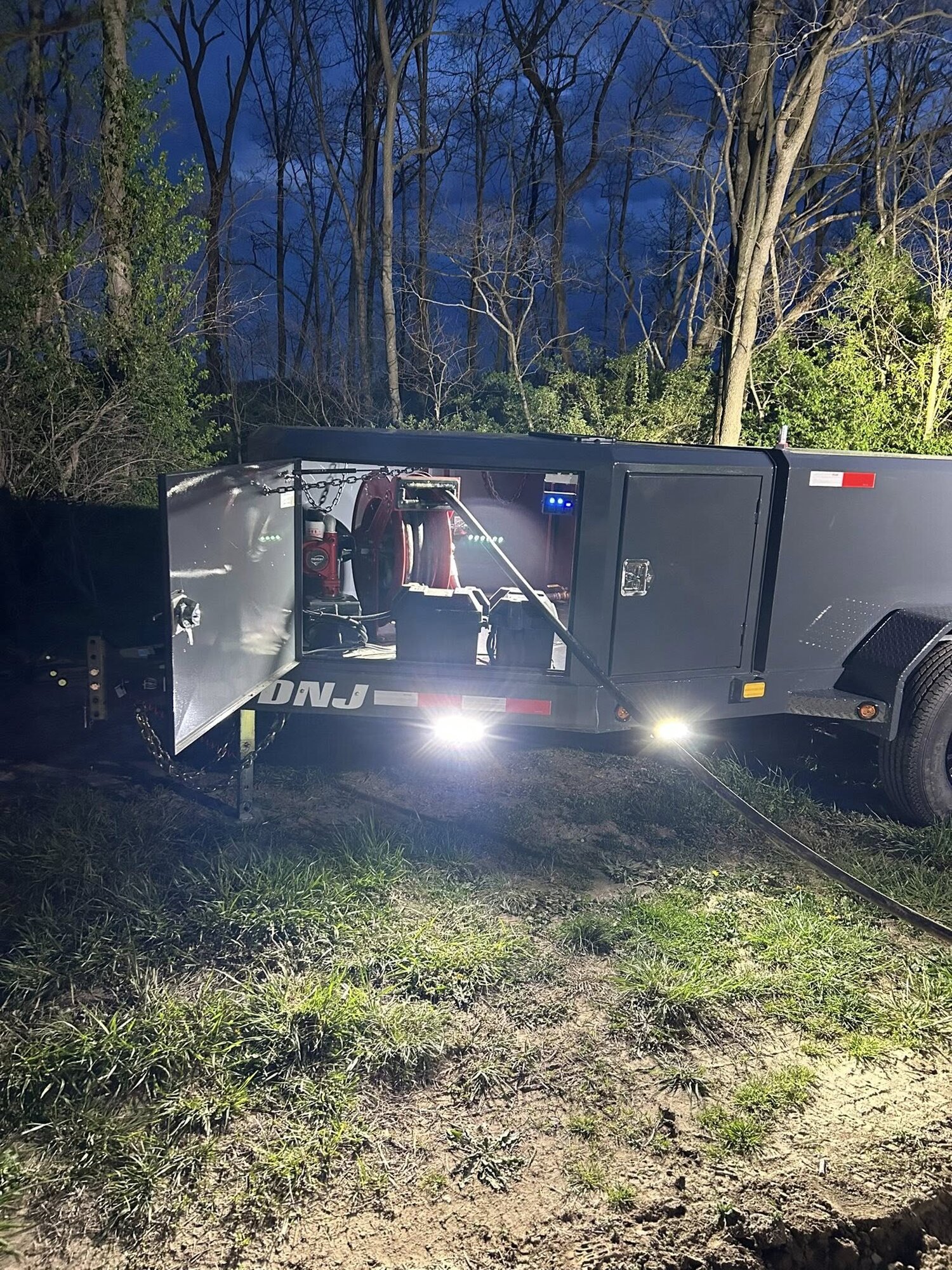 Deluxe fuel trailers with lights on at night