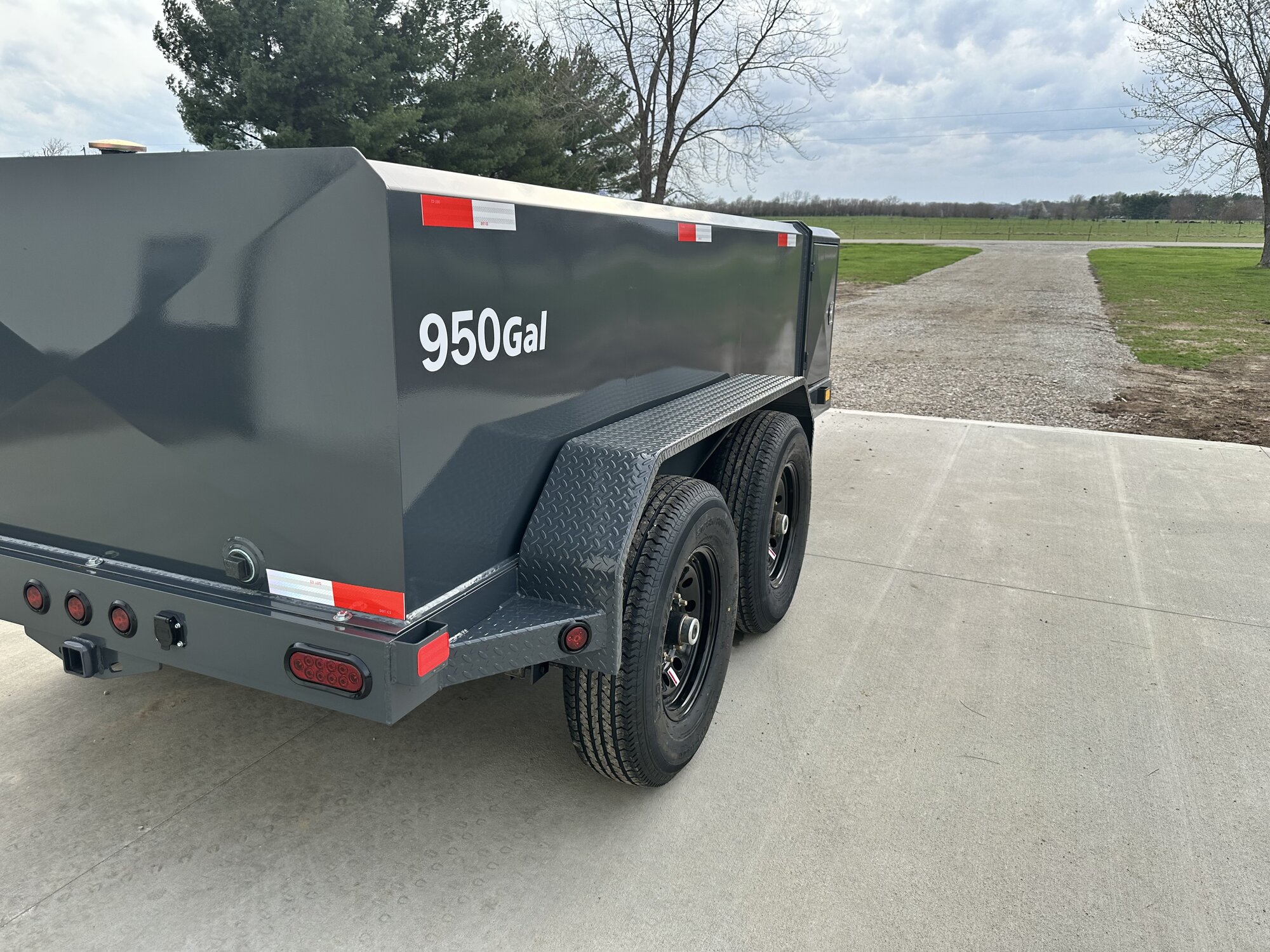 Custom green 750-gallon fuel trailer side view